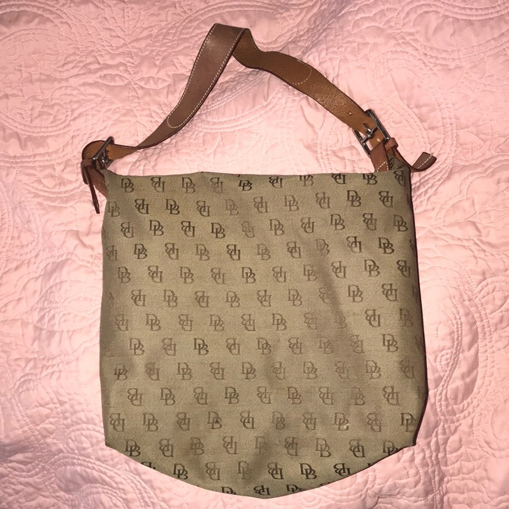 Over the shoulder a Dooney and Bourke bag medium